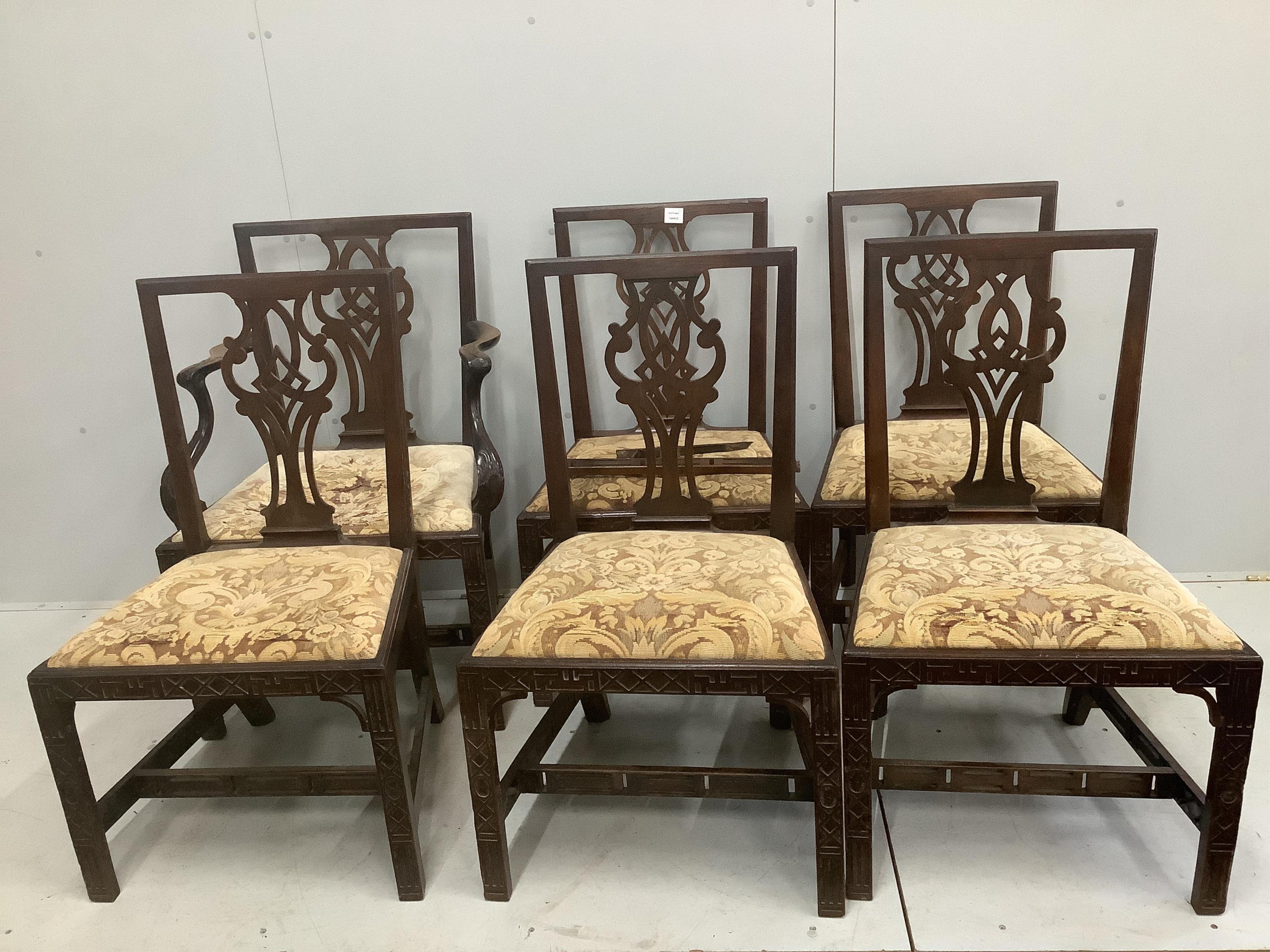 A set of six George III mahogany blind fret carved dining chairs, one with arms. Condition - poor to fair